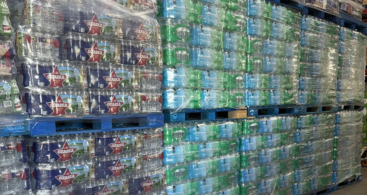 Shrink-wrapped pallets of bottled water stocked for Houston delivery